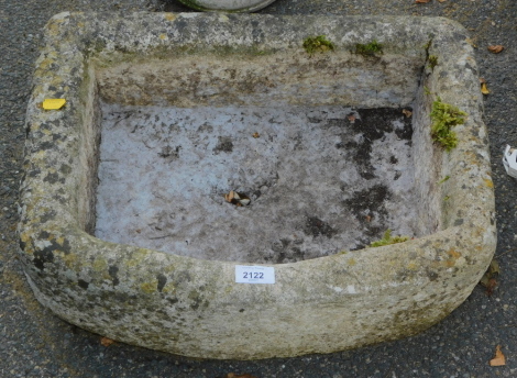 A reconstituted stone trough.