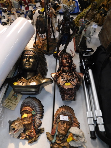 A group of Indian Chief type resin figures, one on horseback, together with various busts and wall mounted plaques. (7)