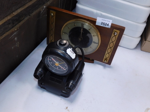 A Metamec 1950's oak cased mantel clock, and a Rhythm Japanese Quartz alarm clock formed as a robot. (2)