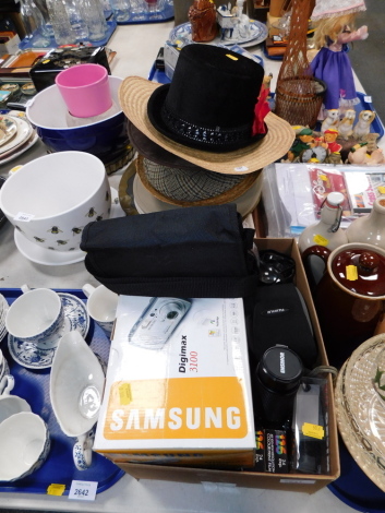 A group of gentleman's hats, cross stitch ware, digital cameras, and Esinor lens, etc. (1 box and 1 tray)