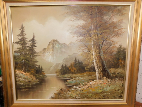 R Thomas (20thC). Woodland scene with mountains, in modern gilt frame.