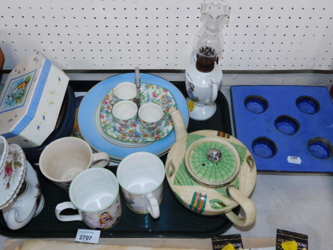 Ceramics and effects, to include Midwinter egg cup stand with three egg cups (AF), Art Deco teapot, a miniature oil lamp, Fruit Gums mug, a pair of Clown mugs, terracotta blue glazed candle holder, etc. (1 tray plus)