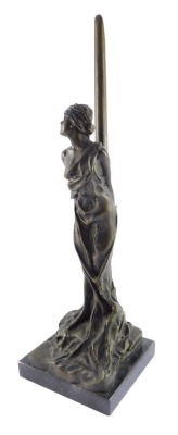 A bronze figure of Andromeda, modeled standing chained to a post, raised on a black marble base, 49cm high.