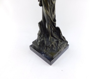 A bronze figure of Andromeda, modeled standing chained to a post, raised on a black marble base, 49cm high. - 3