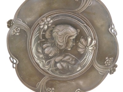 An Art Nouveau late 19thC pewter circular dish, pierced and embossed with a bust portrait of a lady, flowers and sinuous scrolls, 32cm diameter. - 3