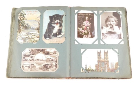 Deltiology: Edwardian and later topographical, sentimental and humorous postcards, greetings cards, etc., in one album. (approximately 283)