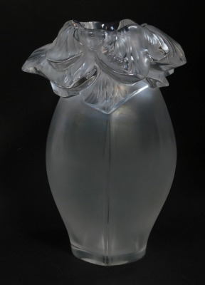 A Lalique clear and frosted glass vase with a flared floral petal rim, etched mark, 22cm high.