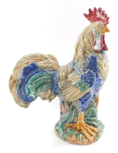 A pottery figure of a cockeral, indistinct monogram to base, 42cm high.