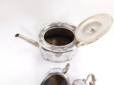 A Victorian silver plated three piece tea set, with foliate scrolled engraving, oval reserve, monogram engraved, comprising teapot, cream jug and sugar bowl. - 3