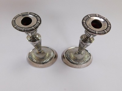 A pair of Victorian loaded silver Adam style candlesticks, of fluted oval form, William Aitken, Chester 1900, 19cm high, 17.5toz all in. - 3