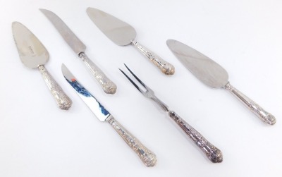 A silver handled carving knife and fork decorated in the Kings pattern, together with a silver handled bread knife and three silver handled cake slices. (6)