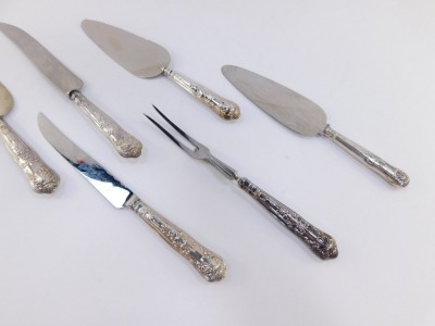 A silver handled carving knife and fork decorated in the Kings pattern, together with a silver handled bread knife and three silver handled cake slices. (6) - 2