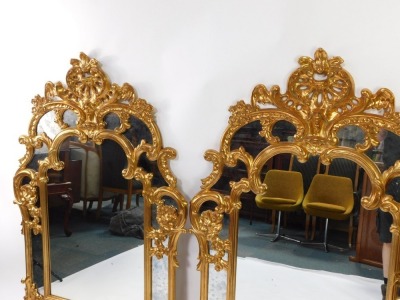 A pair of Belgian rococo style gilt wall mirrors, with seed scroll and floral decoration, 144cm high, 95cm wide. - 2