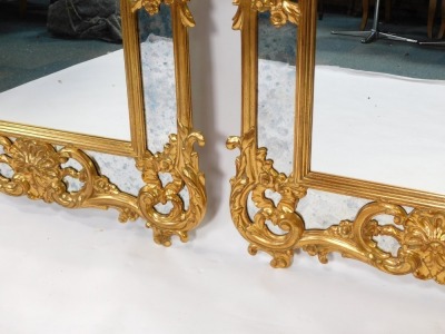 A pair of Belgian rococo style gilt wall mirrors, with seed scroll and floral decoration, 144cm high, 95cm wide. - 3