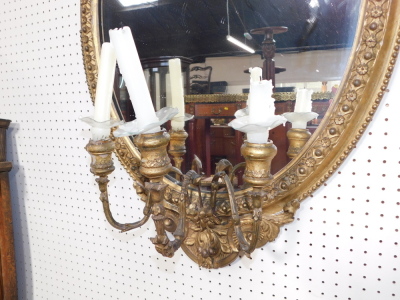 A Victorian gilt wood and gesso oval girandole, with shield and leaf surmount, having three scrolling candle holders, 89cm high, 54.5cm wide. - 3