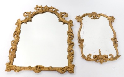 A gilt gesso baroque style wall mirror, decorated with flowers and scrolling leaves, 80cm high, 54cm wide, and a gilt metal rococo style wall mirror cast with hare bell and foliate scrolls, 64cm high, 40cm wide.