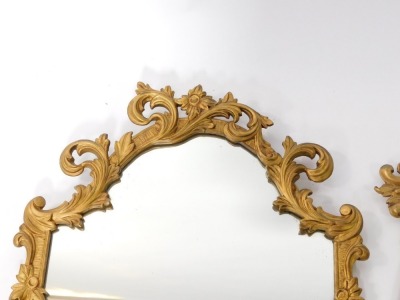A gilt gesso baroque style wall mirror, decorated with flowers and scrolling leaves, 80cm high, 54cm wide, and a gilt metal rococo style wall mirror cast with hare bell and foliate scrolls, 64cm high, 40cm wide. - 3
