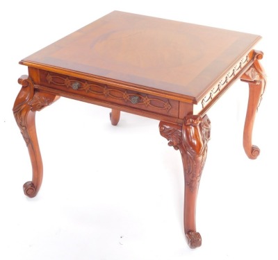 A Wade Furniture Victorian style mahogany coffee table, of square form, with a single frieze drawer, raised on leaf carved cabriole legs and scroll feet, 54cm high, 68cm diameter.