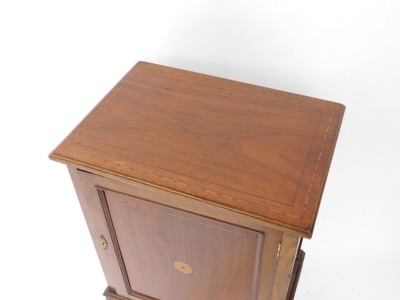 An Edwardian mahogany and inlaid side cabinet, with a single panelled door opening to reveal two shelves, over leaf carved cabriole legs united by a shaped under tier, 94.5cm high, 51cm wide, 36cm deep. - 2