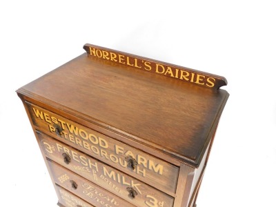 An early 20thC oak chest, of four long drawers, later painted with Horrell's Dairies, Westwood Farm, Peterborough, together with details of items sold and contact information, raised on bun feet, 106cm high, 86cm wide, 45cm deep. - 2