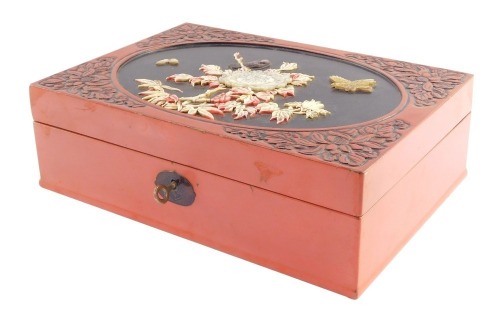 A Chinese cinnabar lacquer and shibayama box, the lid with an oval reserve decorated with birds, flowers and bamboo, 9cm high, 30cm wide, 21cm deep.