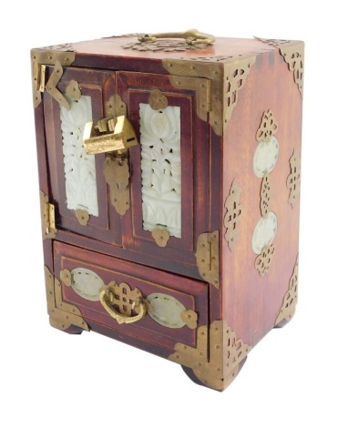 A Chinese hardwood and jadeite table jewellery cabinet, with two doors opening to reveal three drawers above a further drawer raised on bracket feet, 24cm high, 17cm wide, 13.5cm deep. (AF)