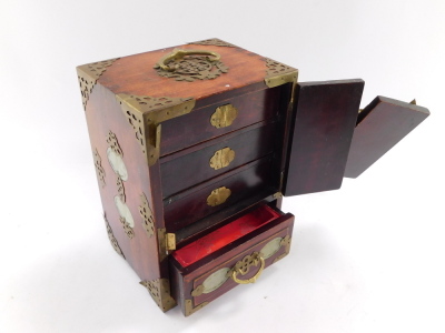 A Chinese hardwood and jadeite table jewellery cabinet, with two doors opening to reveal three drawers above a further drawer raised on bracket feet, 24cm high, 17cm wide, 13.5cm deep. (AF) - 3