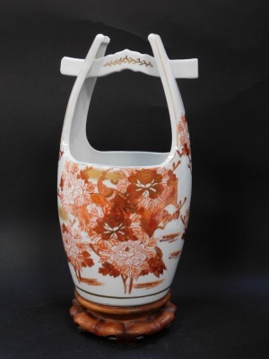 A Japanese porcelain bucket, possibly Arita, decorated in iron red and gold with floral sprays, character seal mark, on a wooden stand, 35cm high. - 2