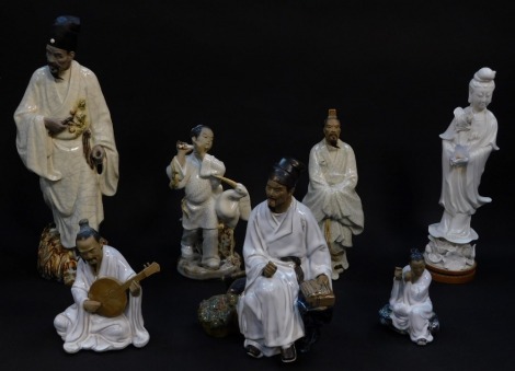 A group of Chinese Republic terracotta and glazed figures, some with crackle glaze, together with a Blanc de Chine porcelain figure modelled as Guanyin (7, AF)