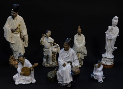 A group of Chinese Republic terracotta and glazed figures, some with crackle glaze, together with a Blanc de Chine porcelain figure modelled as Guanyin (7, AF)