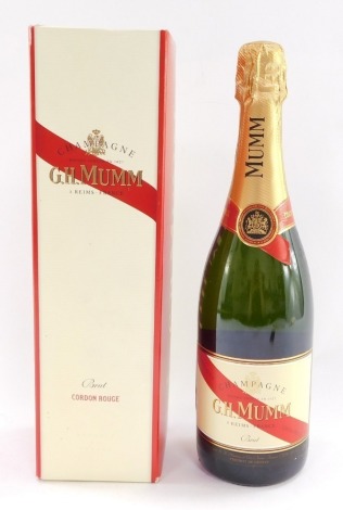 A bottle of GH Mumm champagne, boxed.