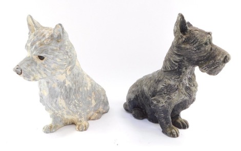 A pair of early 20thC advertising figures for Black & White Whisky, comprising a Scottish Highland white terrier and a black terrier, 20cm and 18cm high respectively.