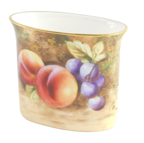 A Royal Worcester porcelain match holder, circa 1958, painted with fruit, signed indistinctly, printed mark, 7.5cm wide.