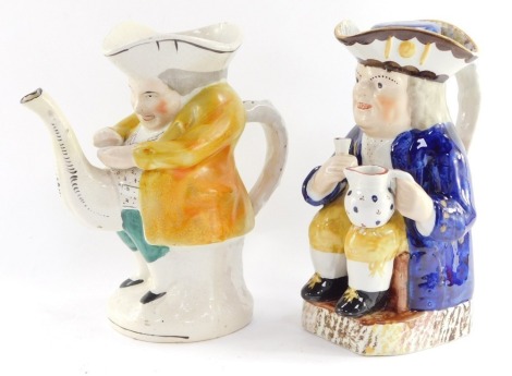 A Staffordshire 19thC pottery toby jug, modelled seated holding an ale glass and jug, his hat having a lid, 24cm high, together with a Staffordshire snuff taker teapot, of risque form, 24cm high. (2, AF)