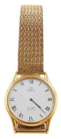 An Omega DeVille gentleman's gold plated wristwatch, circular dial baring Roman numerals, quartz movement, on a plated bracelet strap.