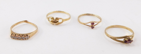 Three 9ct gold and gem set rings, various sizes, 3.2g, and a further ring. (4)