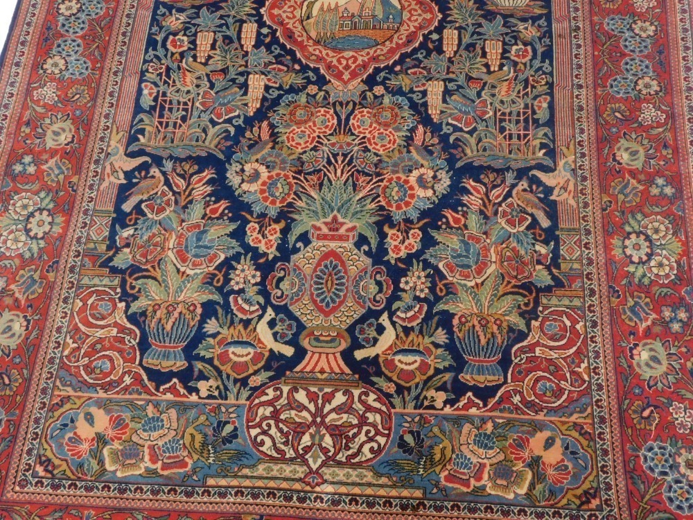 A fine Persian Kurk Kashan blue and red ground wool prayer rug