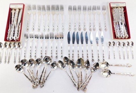 Community silver plated flatware decorated in the Mansion Pattern, including table knives and forks, soup and dessert spoons, fish knives and forks, tea and coffee spoons (quantity)