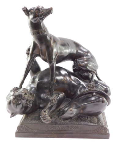 A French 19thC bronze animalier sculpture, of a greyhound suppressing a tiger, raised on a rectangular scroll base, unsigned, 43cm high, 35cm wide. (AF)