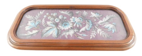 A Victorian mahogany wool and bead work table stand, decorated with flowers, raised on four turned feet, 64cm wide, 31cm deep.