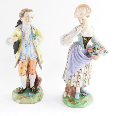 A pair of Dresden porcelain fete gallant figures, the gallant modelled standing holding a spray of flowers, raised on a naturalistic base, the lady with a basket of flowers, printed marks, 19cm high.