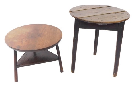 A Georgian mahogany cricket table, the circular top raised on three turned legs united by a triangular shaped under tier, 48cm high, 63cm diameter., and a further cricket table, the elm top raised on a stained pine triangular base, 71.5cm high, 61cm di