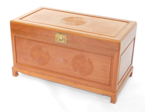 A Chinese teak chest, with camphorwood interior, 56cm high, 102cm wide, 53cm diameter.