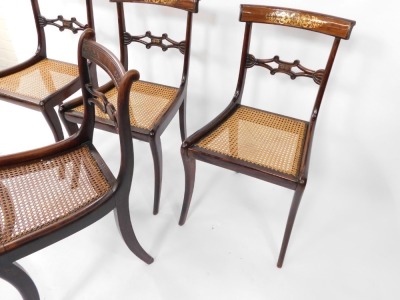 A set of three Regency rosewood and brass inlaid single dining chairs, with cane seats, together with another similar, raised on sabre legs. (4) - 3