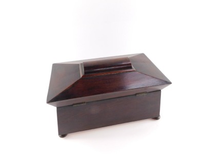 A Regency rosewood tea caddy, of sarcophagus form, the hinged lid opening to reveal a central recess flanked by two canisters, raised on bun feet, 19cm high, 34cm wide, 18cm deep. - 4