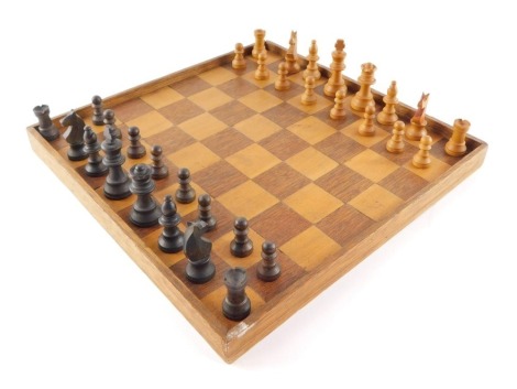 A Staunton chess set, together with a chess board.