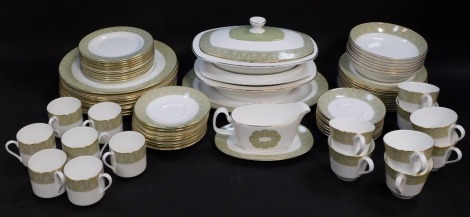 A Royal Doulton porcelain part dinner, tea and coffee service decorated in the Sonnet pattern, comprising oval meat platter, pair of vegetable tureens and covers, sauce boat on stand, nine dinner and ten dessert plates, seven soup bowls, and eleven side p