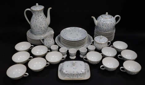 A Furstenberg porcelain breakfast service, decorated in blue and white with foliate decoration, pattern number 01345, comprising tea and coffee pots, cream jug and sucrier, butter dish and cover, five egg cups, bread plate, twelve cups and saucers, and t