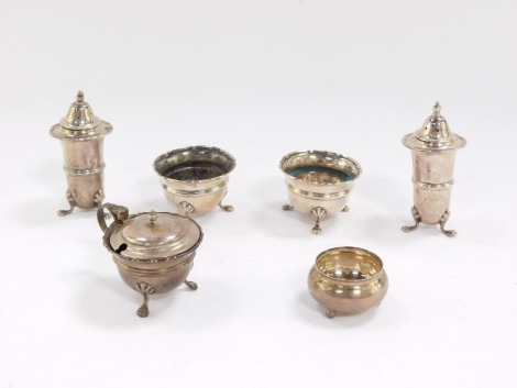 A George V silver salt, of cauldron form, Birmingham 1916, and a five piece condiment set, comprising a pair of pepperettes, a pair of salts and a mustard pot, Birmingham 1917/18, 5.8toz.