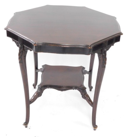 A mahogany window or occasional table, the shaped moulded edge, on leaf carved splayed supports, with under tier, 73cm high, 75cm wide.